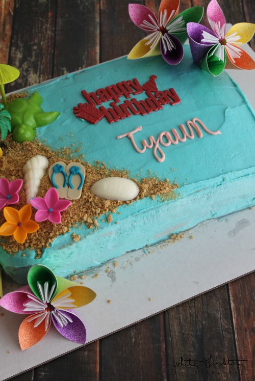 Triple Pineapple Luau Cake, a luau themed decorated cake made with pineapple cake and pineapple chunk frosting. YUM!!