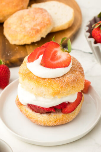 assembled biscuit strawberry shortcake on a small plate