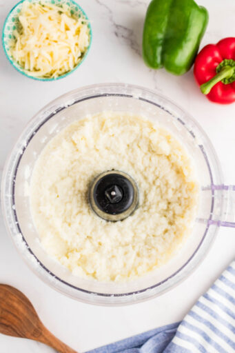 pureed steamed cauliflower and milk in a food processor