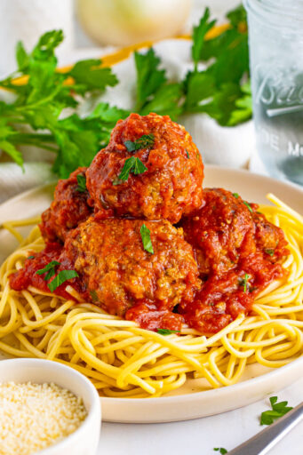 italian meatballs with marinara served over spaghetti