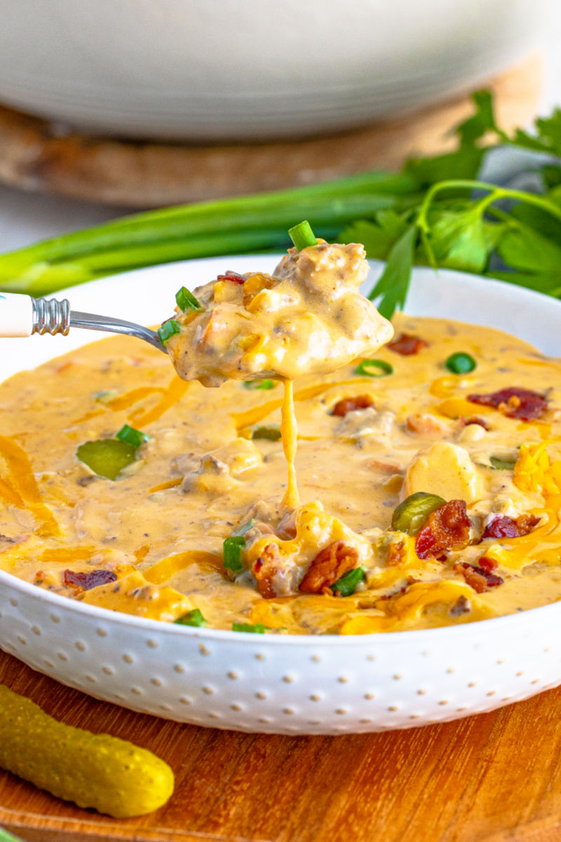spoonful of bacon cheeseburger soup over the bowl